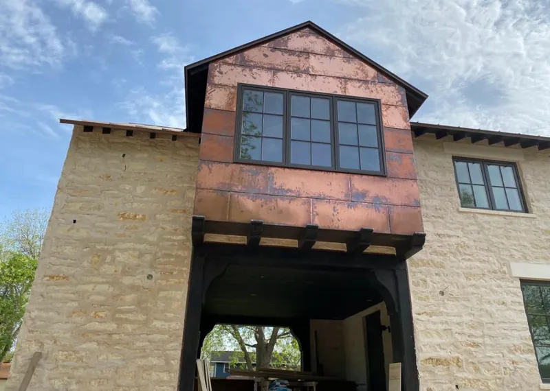 Copper metal panel facade on a stone building for Skylight Installation in Key Biscayne