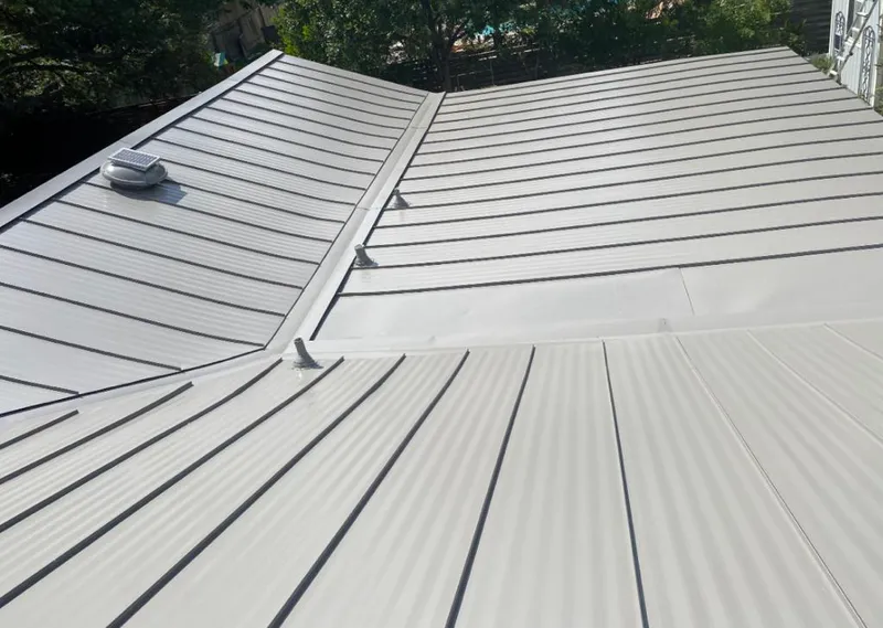 Solar attic fan installed on a metal roof for Roof Ventilation in Key Biscayne
